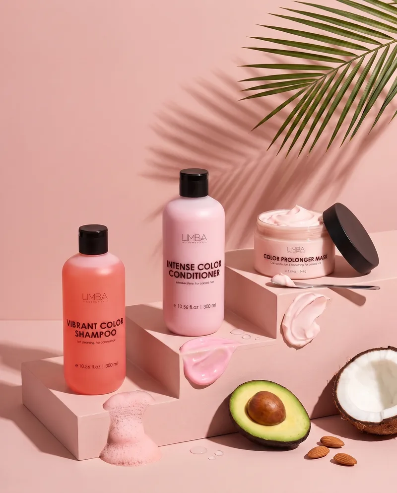 Limba color care routine: Vibrant Color Shampoo, Intense Color Conditioner and Color Prolonger Mask on pink steps with avocado, coconut and almonds